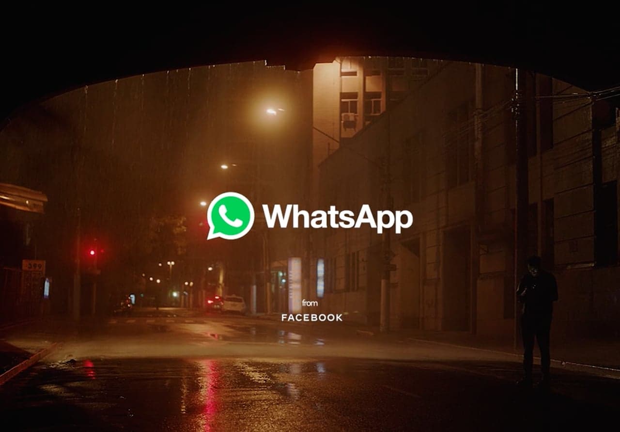 WhatsApp logo over a dimly lit city street in the film’s closing frame.
